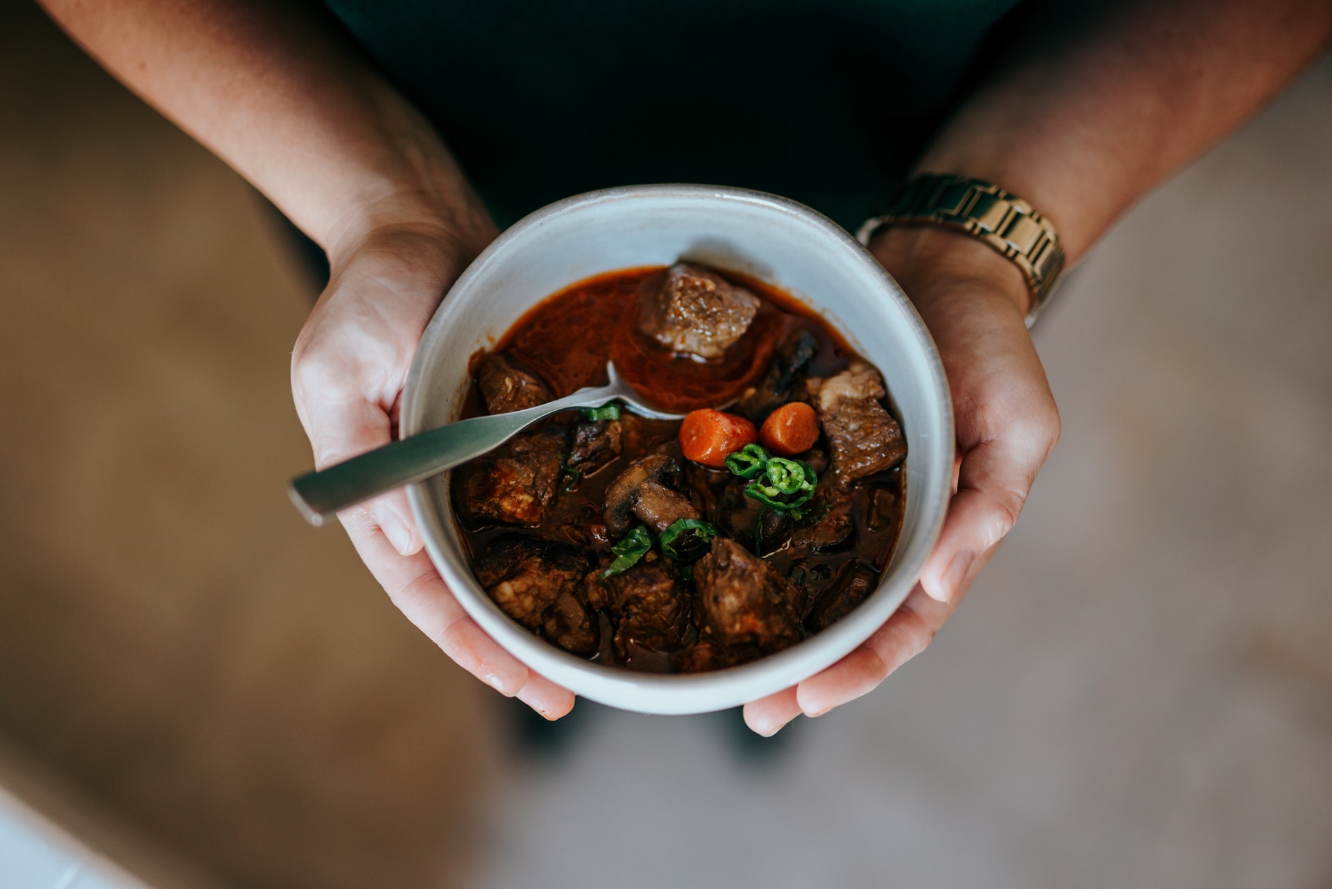 Care Ministry - Person holding white bowl with soup
