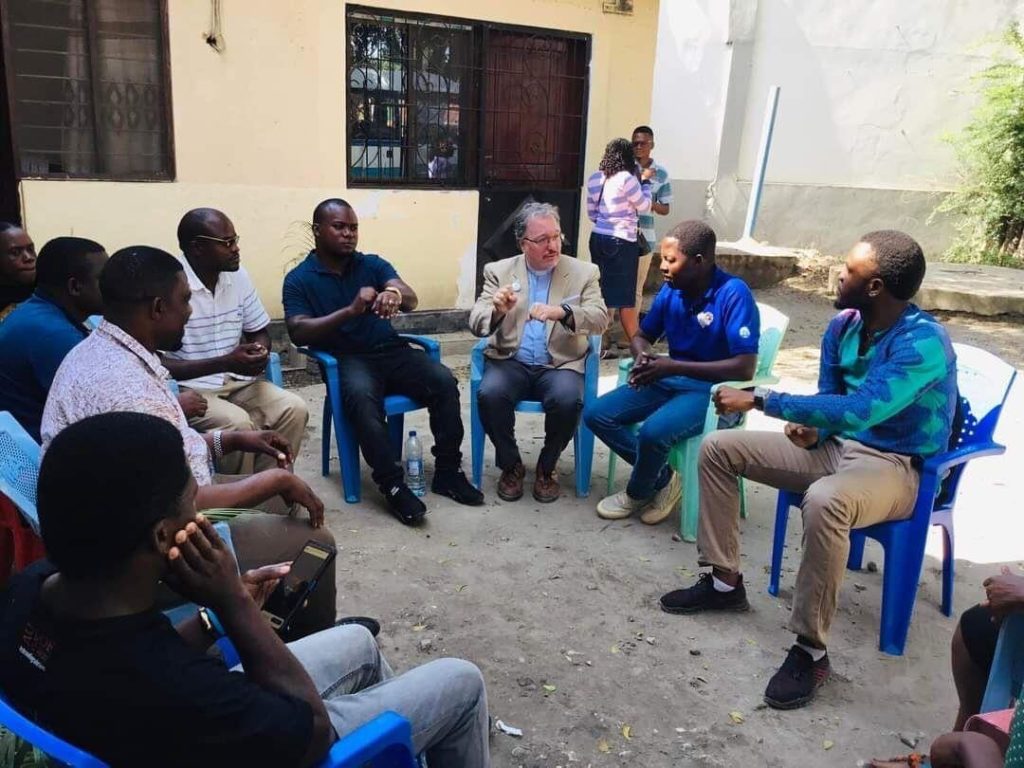 Yatosha Deaf School in Tanzania - group sitting in a circle outdoors